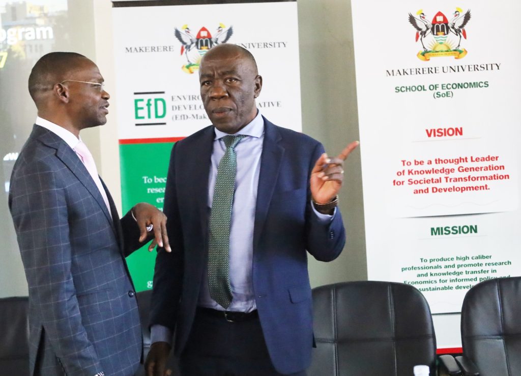 Prof. Umar Kakumba EfD-Mak Board Chair (Left) interacts with Eng. Prof. Henry Alinatwe (Right) after the opening session.