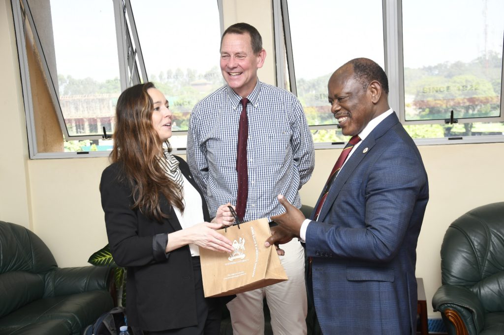 Prof. Barnabas Nawangwe (Right) presents souvenirs to the delegation.