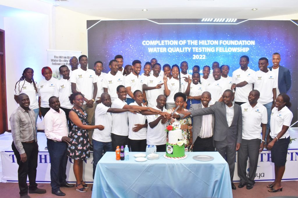 Prof. Gorettie Nabanoga (Centre) is joined by staff and trainees to cut cake, SFTNB Conference Hall, CAES, Makerere University, Kampala Uganda. 