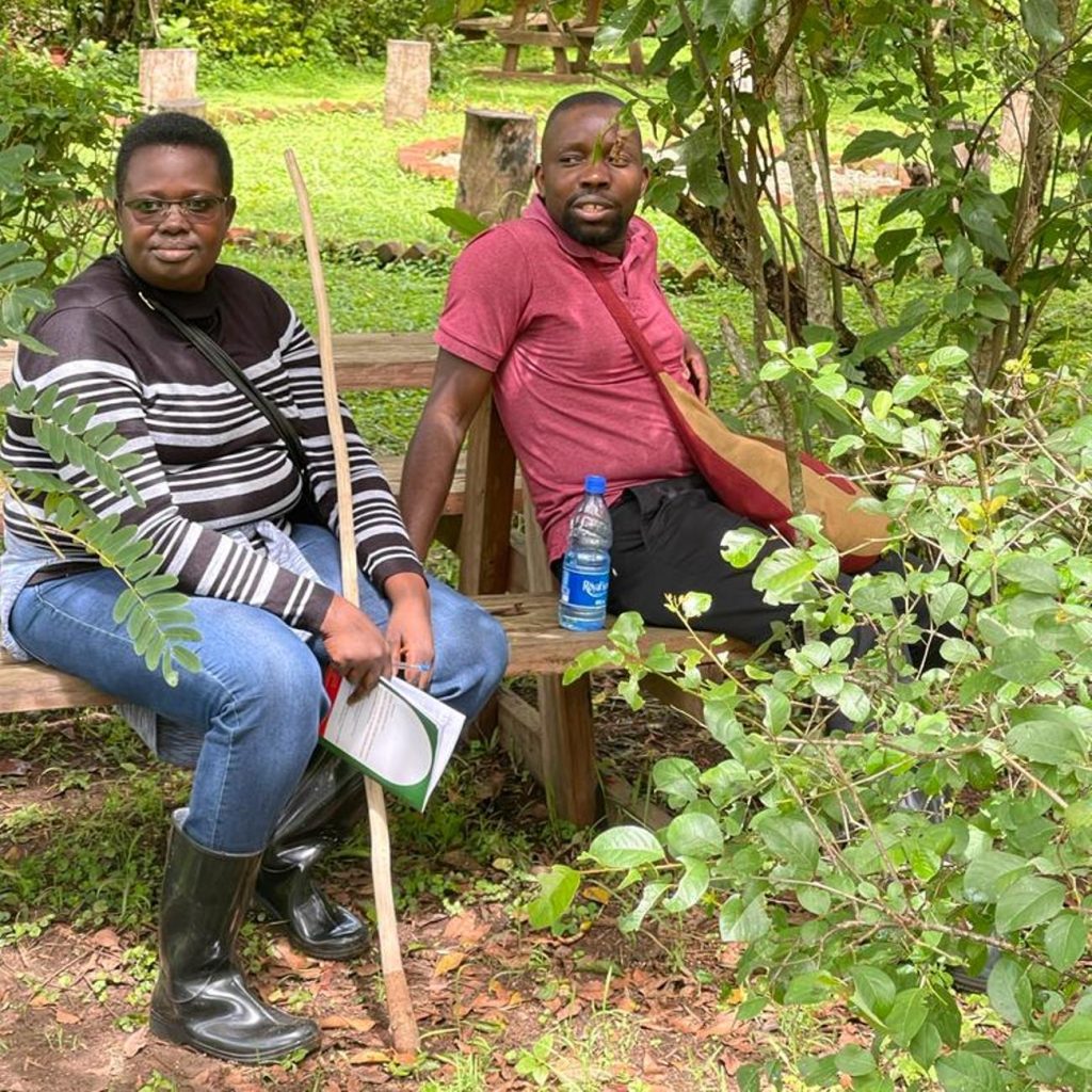 Dr. Mudondo Constance, Acting Dean SoDLL and Mr. Byekwaso Lwanga Jordan taking a rest after nature walk.