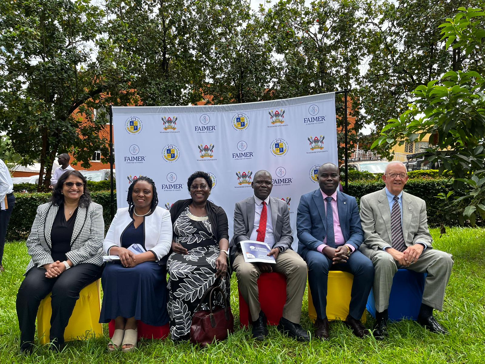 The Principal CHS-Prof. Damalie Nakanjako (2nd L) with Director EAFRI-Prof. Sarah Kiguli (3rd L), Associate Director EAFRI-Professor Samuel Maling (3rd R) and FAIMER Officials at the launch on 10th May 2023, Deans Gardens, CHS, Makerere University, Mulago Hill, Kampala Uganda.