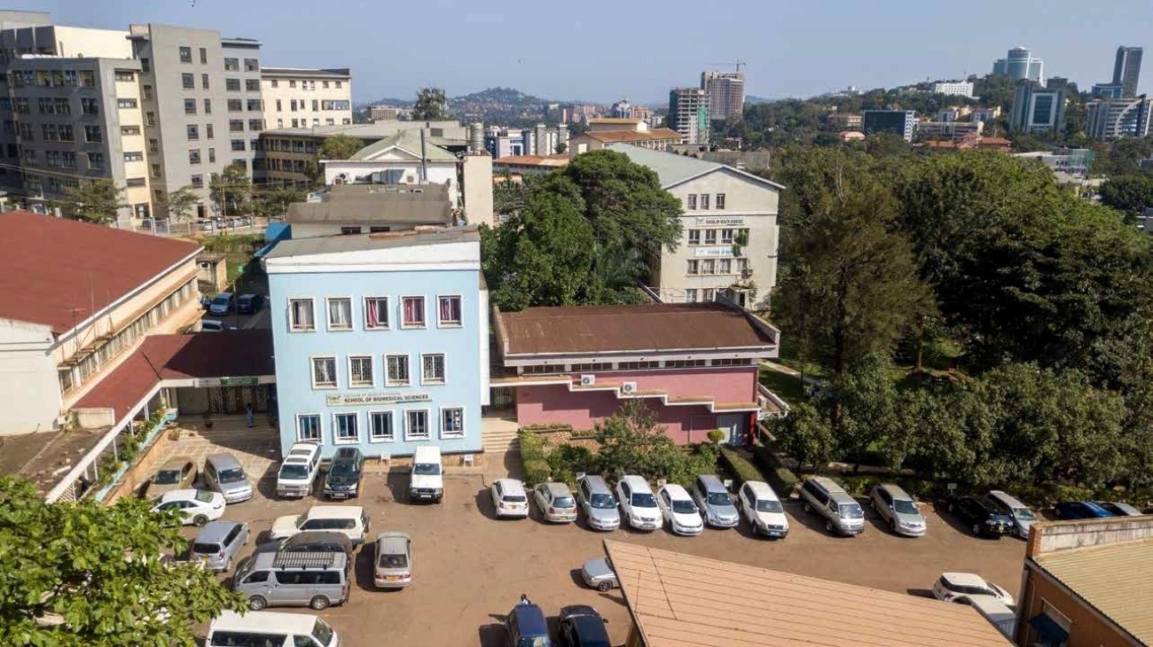 An aerial photo of the College of Health Sciences (CHS), Makerere University showing Left to Right: The Sir Albert Cook Memorial Library, School of Biomedical Sciences, Davies Lecture Theatre, School of Public Health, Mulago Specialised Women and Neonatal Hospital (MSWNH)-Background Left and Nakasero Hill-Background Right, Kampala Uganda.