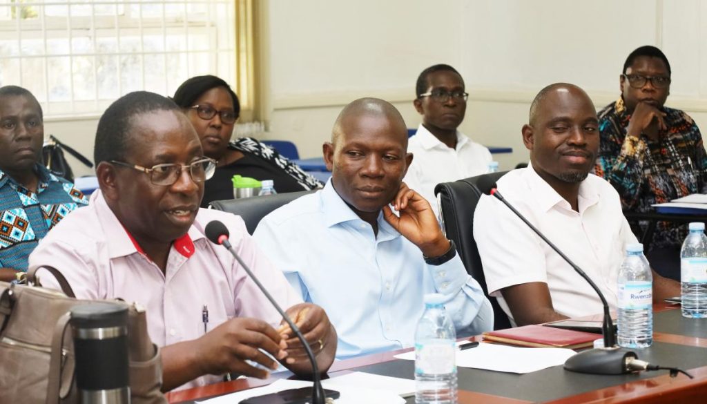 Prof. Peter Atekyereza (L) flanked by his CHUSS colleagues contributes to the discussion during the meeting. Makerere University, Kampala Uganda.