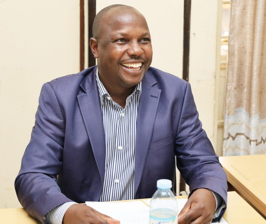 Dr. Denis Muhangi reacts to a remark during the handover ceremony, SWASA, CHUSS, Makerere University, Kampala Uganda.