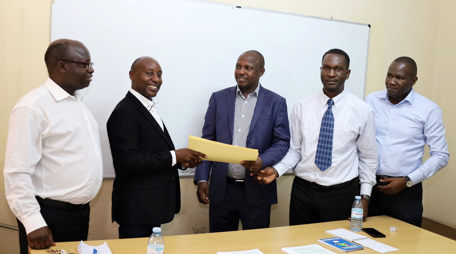 Left to Right: Dr. Justus Twesigye, Prof. Eddy Walakira, Dr. Denis Muhangi, Mr. Luwuliza Aggrey and the CHUSS HRO Mr. Godfrey Makubuya during the handover on 11th May 2022, School of Social Sciences, CHUSS, Makerere University, Kampala Uganda.