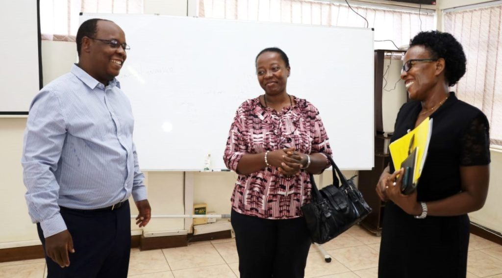 Dr. Peter Nabende, Nyakalesi Margaret and Susan Mbabazi interact after the meeting, Conference Hall, Block A, CoCIS, Makerere University, Kampala Uganda.