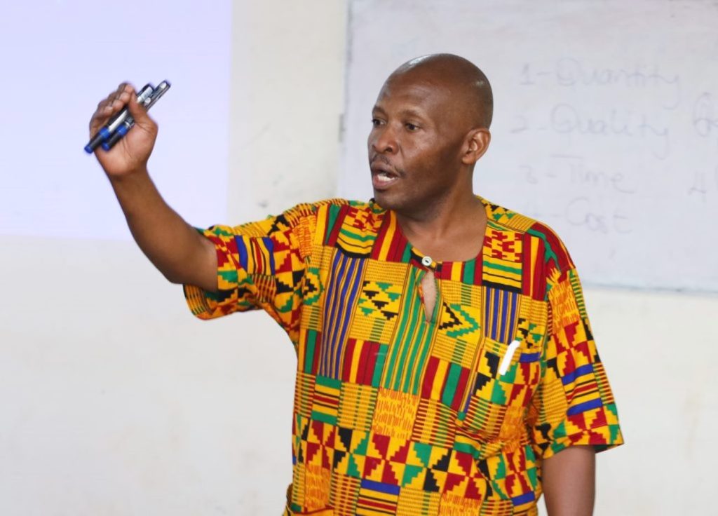 Mr. Julius Lebo speaking on effective team building and communication. CoCIS, Makerere University, Kampala Uganda.