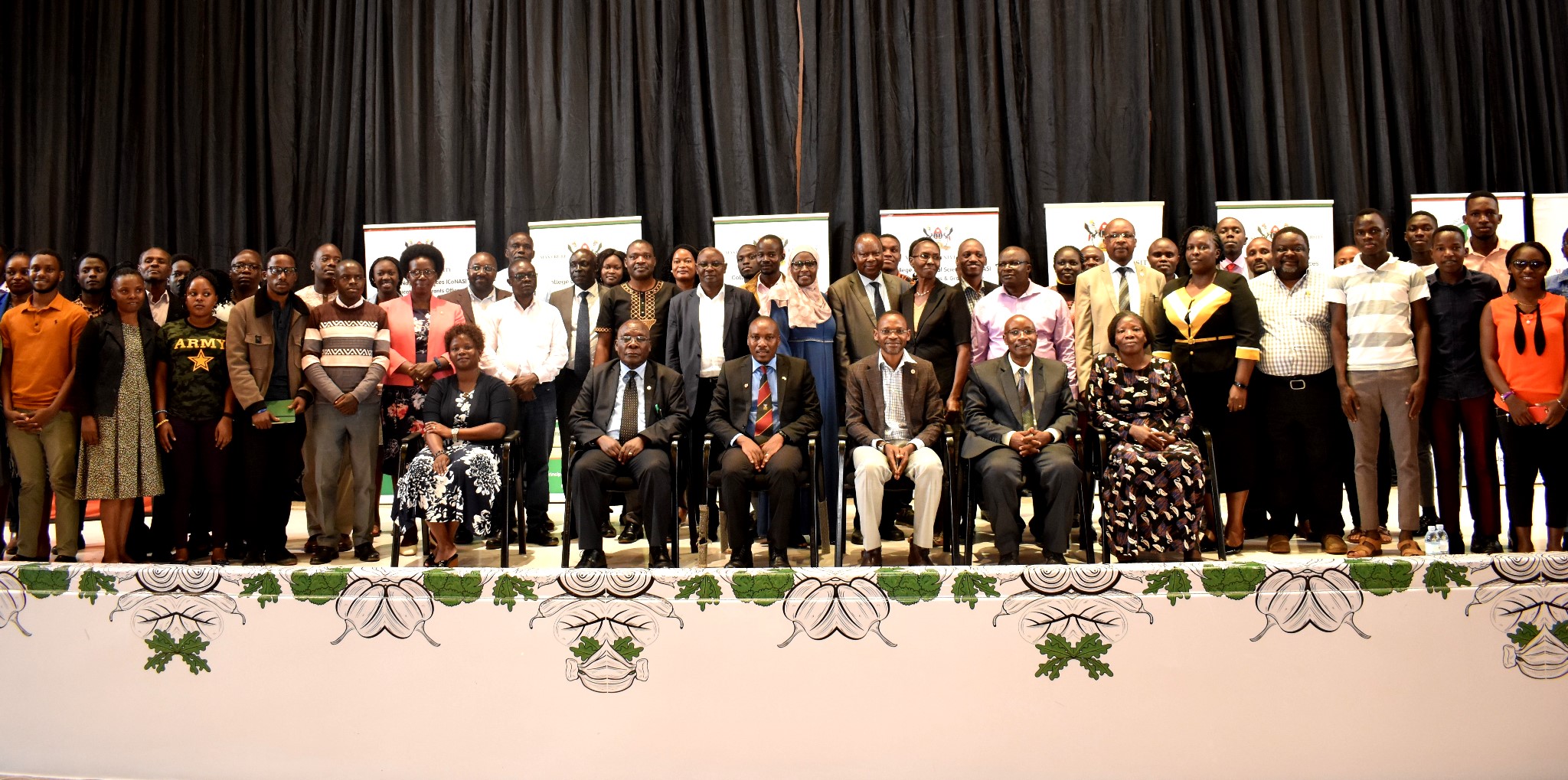 Lugujjo (2nd L), Commissioner, Physical Education and Sports, MoES-Ms. Hajara Ddembe (R) and Director of Research, NARO-Dr. Barbara Mugwanya Zawedde (L) with participants (standing) at the BioSU inception meeting held at the Yusuf Lule Auditorium, Makerere University on 5th May 2023, Kampala Uganda.