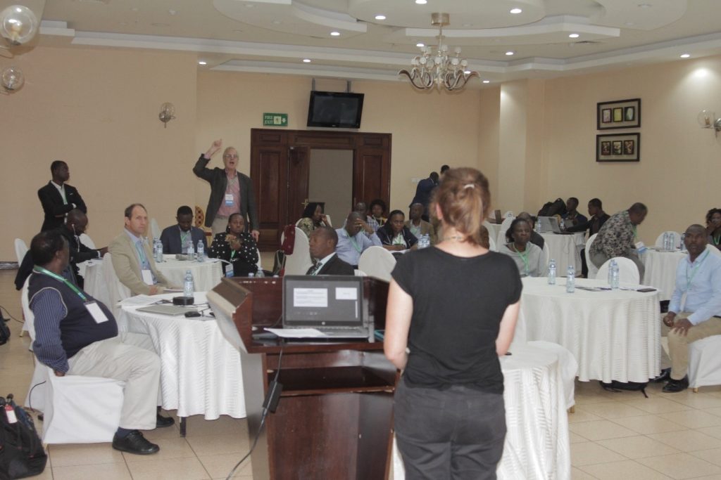 Participants engaged in one of the plenary sessions. 