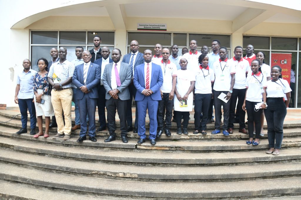 The Vice Chancellor, Prof. Barnabas Nawangwe (front row, 4th Left) with the representative of the Minister of Science, Technology and Innovation, Dr Cosmas Mwikirize (C), and the research team at the launch of the MakSol Cooker on 14th June 2023. School of Food Technology, Nutrition and Bioengineering Conference Hall, CAES, Makerere University, Kampala Uganda.