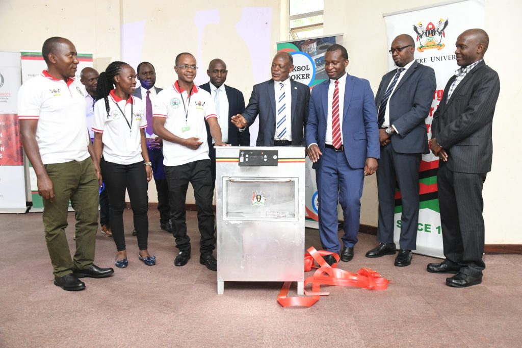 The Vice Chancellor, Prof. Barnabas Nawangwe (4th R) expresses appreciation for the innovation. School of Food Technology, Nutrition and Bioengineering Conference Hall, CAES, Kampala Uganda.