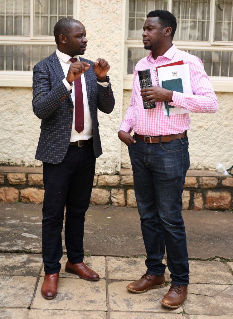 The author and class representative-Davidson Ndyabahika (Left) shares with Pastor Mark Odeke (Right) shortly after the meeting. College of Humanities and Social Sciences (CHUSS), Makerere University, Kampala Uganda.