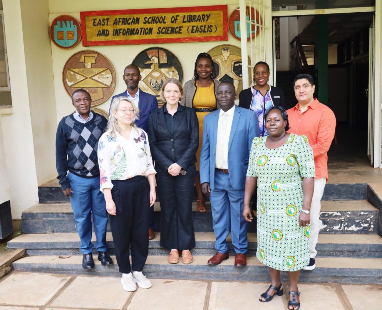 Prof. Constant Obura and the team pose for a group photo at the entrance of the School after the meeting on 25th April 2023. EASLIS, CoCIS, Makerere University, Kampala Uganda.