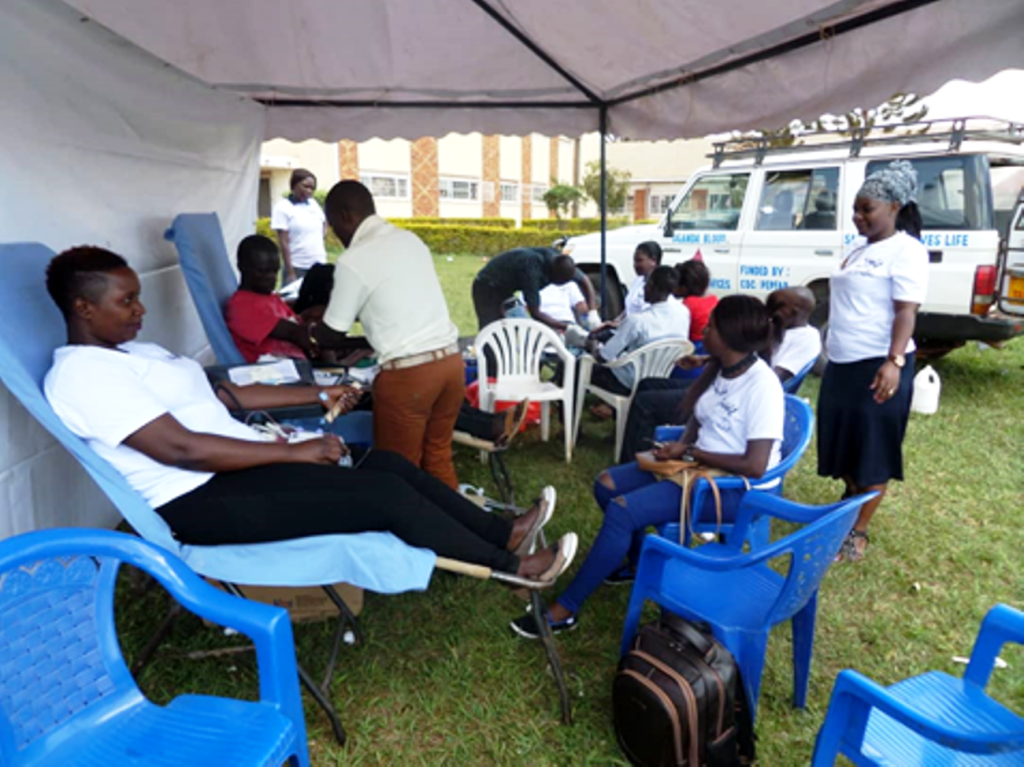 Participants take part in a blood donation drive during one of the medical camps.