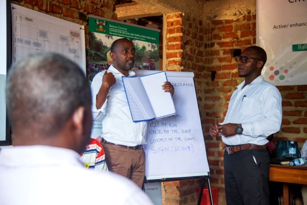 The Executive Director of MUCHAP-Dr. Dan Kajungu (Left) and NIRA District Registration Officer-Aloysius Ochola (Right) during death registration training at MUCHAP Offices in Iganga District on Monday 29th May, 2023.