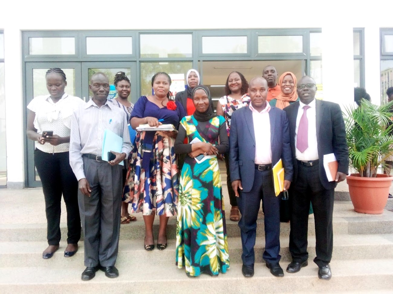 The Quality Assurance Directorate's Mr. Mugisha Richard (Front Row, Second from Right) and Ms. Irene Rebecca Namatende (Second Row, Second from Left) with some Members of the Makerere University Business School-Kampala Management Team after the visit on 18th June 2023, Nakawa, Kampala.