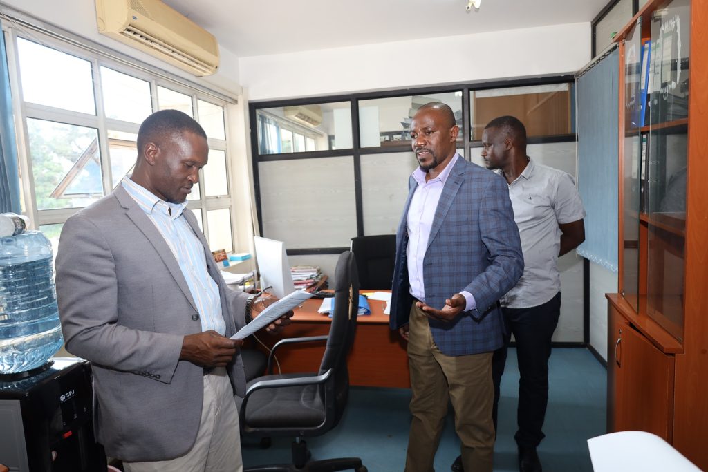Left to Right: The Directorate of Internal Audit's Mr. Aggrey Luwuliza, Mr. Stephen Byarugaba and Mr. David Ikomo tour the procurement office. Level 4, Block A, College of Computing and Information Sciences (CoCIS), Makerere University, Kampala Uganda, East Africa.