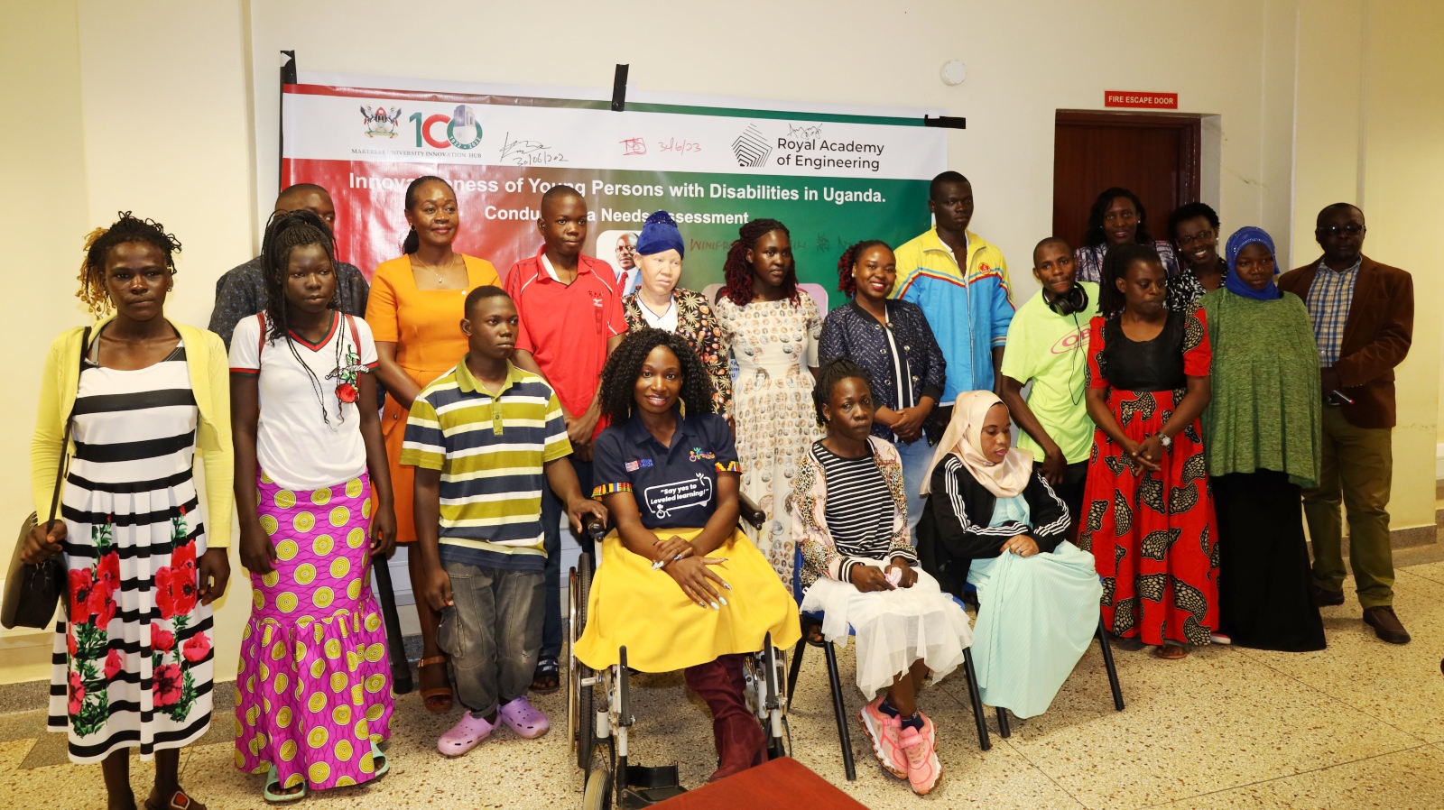 The Dean of Students-Mrs. Winifred Kabumbuli (Rear 2nd Left) with officials and some of the Persons With Disabilities at the launch on 30th June 2023. Makerere Innovation Hub, Yusuf Lule Central Teaching Facility, Makerere University, Kampala Uganda.