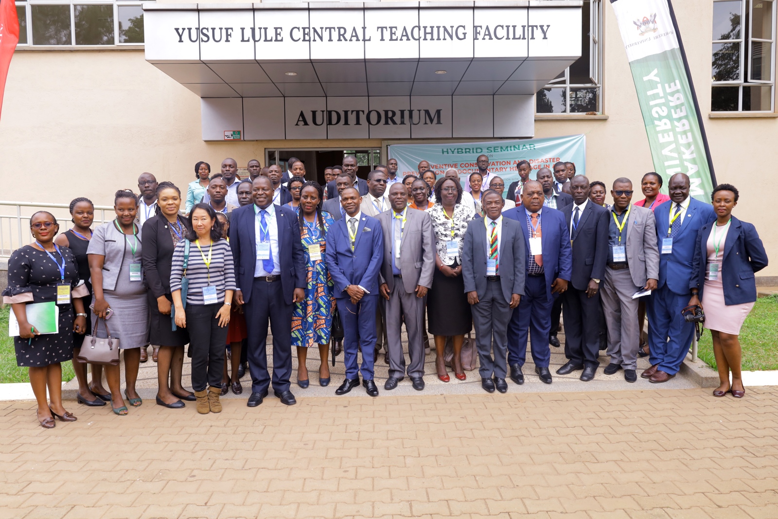 The DVCAA-Prof. Umar Kakumba (Centre blue suit) with Prof. Elisam Magara (To his Left), Ms. Misako Ito (5th Left), Principal CoCIS-Prof. Tonny Oyana (6th Left) and other officials at the Preventive Conservation and Disaster Reduction of Documentary Heritage in Africa Seminar opening ceremony on 4th July 2023, Yusuf Lule Auditorium, Makerere University. Kampala Uganda. East Africa.