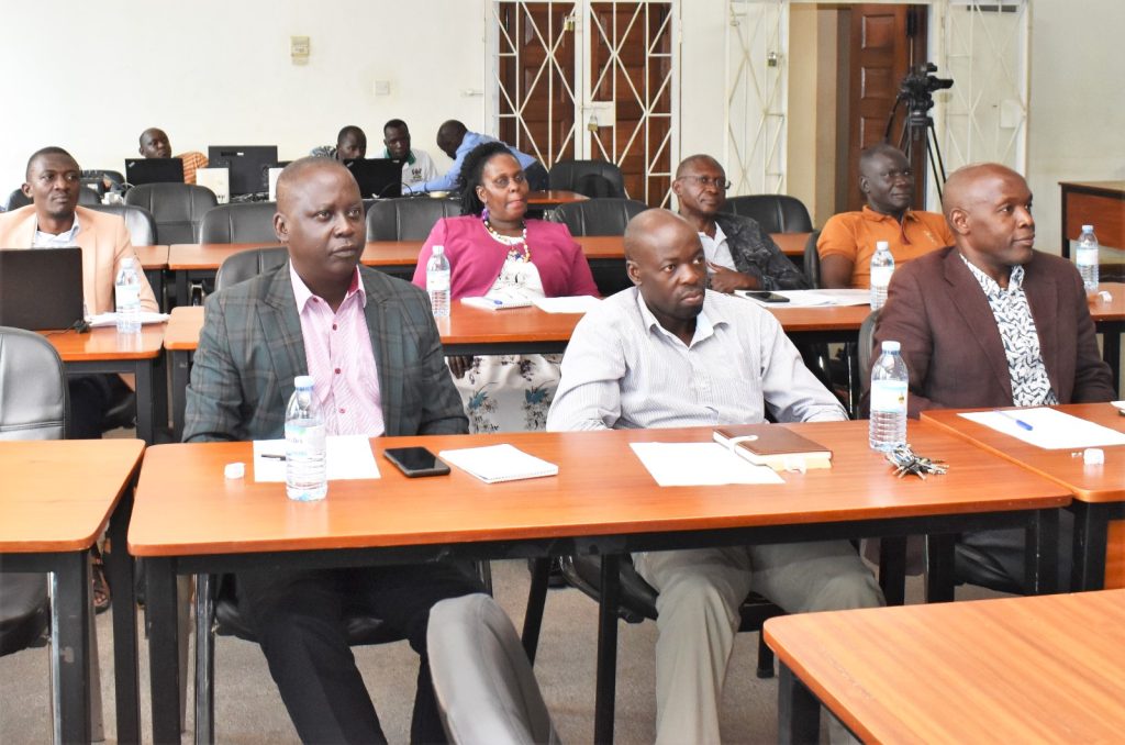 Makerere University staff from CoNAS, Dr. Michael Owor, Dean School of Physical Sciences (R) and Dr. Denis Okello, Head, Department of Physics (L) during the workshop. Telepresence Centre, Senate Building, Makerere University, Kampala Uganda.