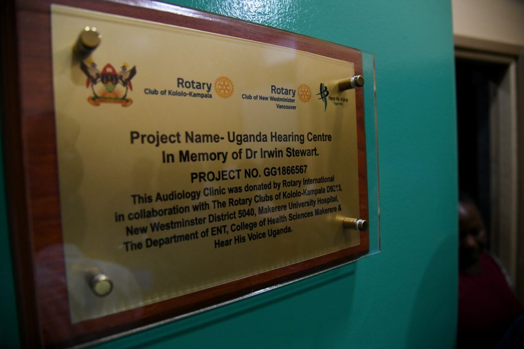 The Plaque at the Audiology Clinic. "Project Name-Uganda Hearing Centre. In Memory of Dr. Irwin Stewart. PROJECT NO. GG1866567. This Audiology Clinic was donated by Rotary International in collaboration with The Rotary Clubs of Kololo-Kampala D9213, New Westminster District 5040, Makerere University Hospital, The Department of ENT, College of Health Sciences Makerere & Hear His Voice Uganda."