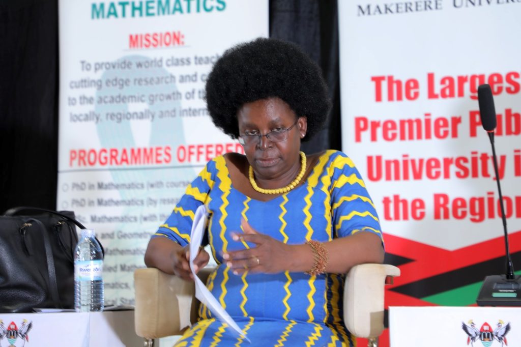 Hon. Dr. Monica Musenero follows proceedings at the conference. Yusuf Lule Central Teaching Facility, Makerere University, Kampala Uganda. 
