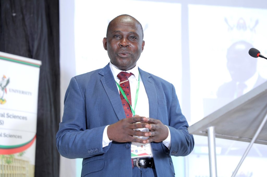 Prof. John Mango, addresses the Conference. Yusuf Lule Central Teaching Facility, Makerere University, Kampala Uganda. East Africa.