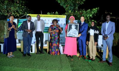H.E. Amb. Dr. Arikana Chihombori-Quao (4th Right) shows off her portrait as Left to Right: Mrs. Esteri Akandwanaho Muhoozi, Mr. Jacob Eyeru, Mr. Andrew Tumusiime, Dr. Suzie Nansozi Muwanga, Mr. Damian Courtland Cook, H.E. Mariat Namiiro and Hon. Moses Jok Aluong witness at the Ekyooto on 26th July 2023, JNLC Gardens, Makerere University. Kampala Uganda, East Africa.