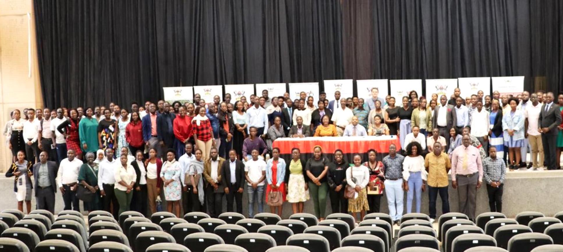 Graduate Students from the College of Humanities and Social Sciences (CHUSS) and officials pose for a group photo during the Orientation Ceremony on 25th August 2023. Yusuf Lule Auditorium, Makerere University, Kampala Uganda. East Africa.