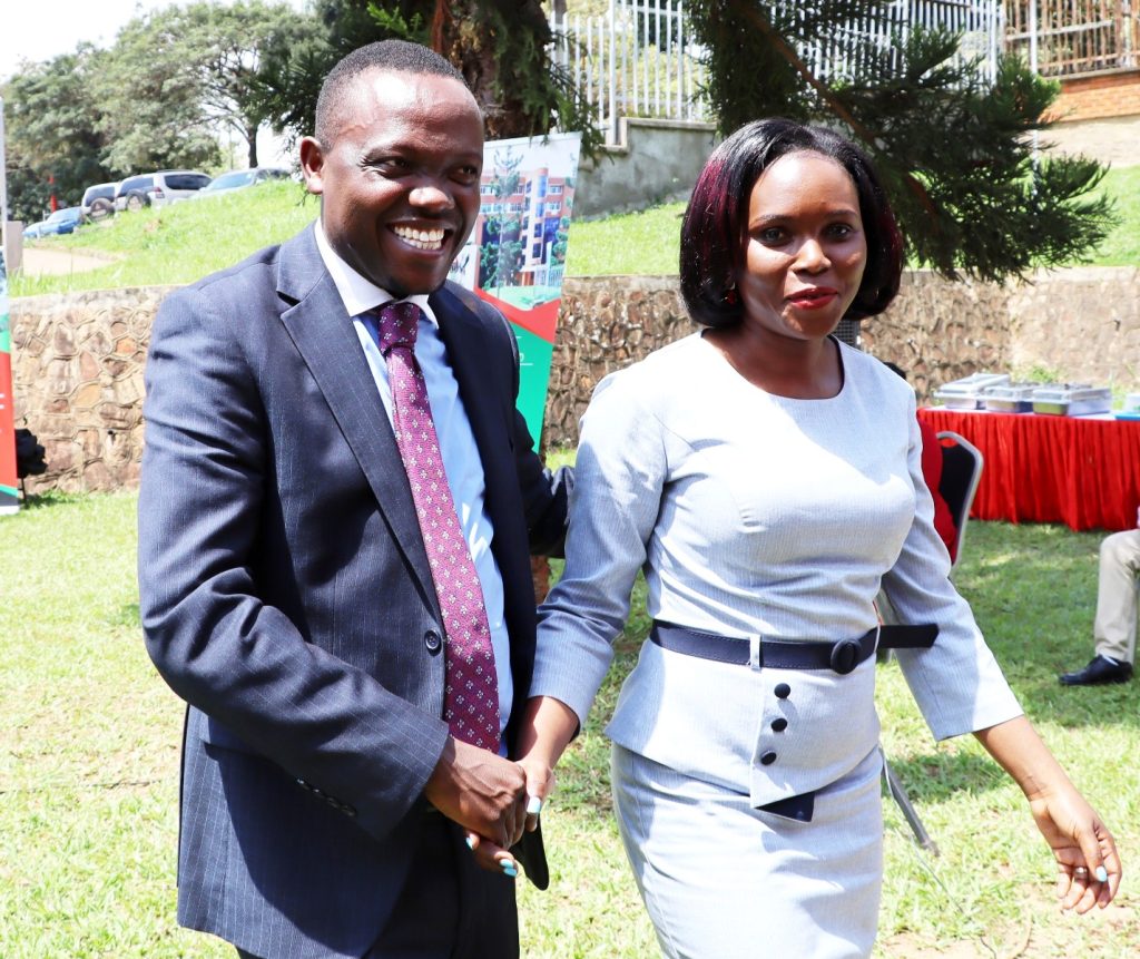 Dr. Rose Nakasi being escorted from the podium by husband Counsel  Galandi Tony Kiire also Managing Director Partner Diamond Advocates. College of Computing and Information Sciences (CoCIS), Makerere University, Kampala Uganda, East Africa.