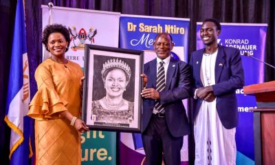 Her Royal Highness Nnaabagereka Sylvia Nagginda (Left) receives a portrait from the Vice Chancellor, Prof. Barnabas Nawangwe (Centre) after delivering the Second Sarah Ntiro Annual Public Lecture on 31st August 2023 in the Yusuf Lule Auditorium, Makerere University. Right is the artist Mr. Brian Ainamaani. Kampala Uganda, East Africa.