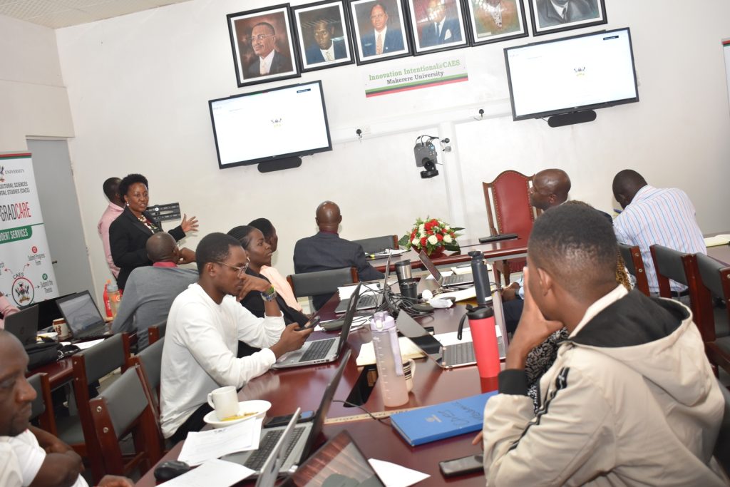 The Principal of CAES, Prof. Gorettie Nabanoga, supported by Mr. Arthur Opio from DICTS demonstrating how the System works. CAES, Makerere University, Kampala Uganda, East Africa.