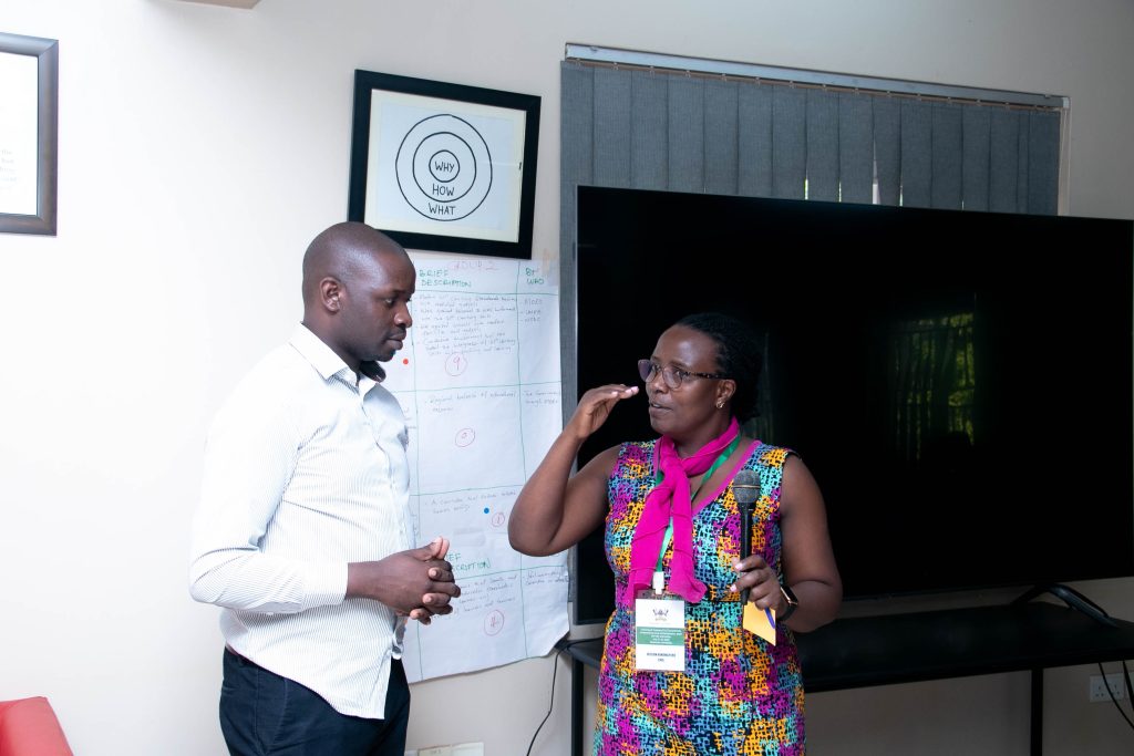 Alison Annet Kinengyere, a Library and Information Scientist at Sir Albert Cook Medical Library and a iCARTA facilitator demonstrates to one of the participants during the training. Makerere University School of Public Health, Plot 28 House 30, Upper Kololo Terrace, Kampala Uganda, East Africa.