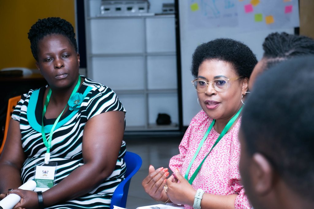 Dr. Daphney Nozizwe Conco, a Senior Lecturer at University of the Witwatersrand School of Public Health and CARTA facilitator (Centre) mentors some of the APAS ToT trainees at Makerere University. Makerere University School of Public Health, Plot 28 House 30, Upper Kololo Terrace, Kampala Uganda, East Africa.