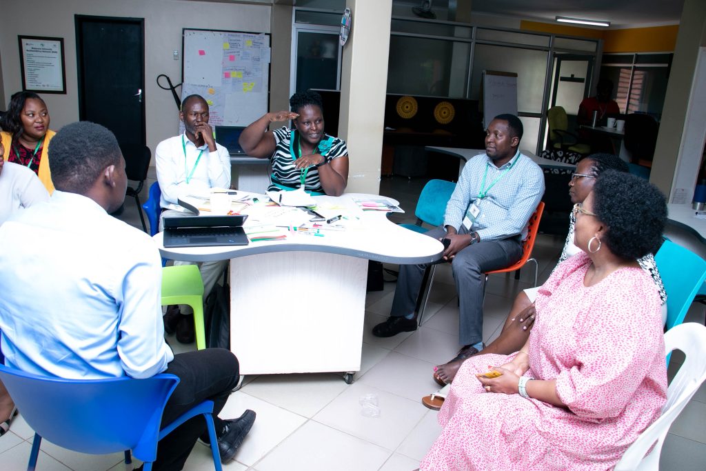 Dr. Patience Tugume a Lecturer from the Department of Plant Sciences, Microbiology and Biotechnology at Makerere University and an APAS trainee speaks during the workshop. Makerere University School of Public Health, Plot 28 House 30, Upper Kololo Terrace, Kampala Uganda, East Africa.  