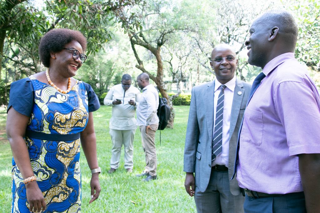 Dr. Rhoda Wanyenze, Professor and Dean, MakSPH (Left) interacts with Director of the Directorate of Research and Graduate Training and CARTA focal person at Makerere University, Prof. Edward Bbaale (Centre) and Mr. Herbert Bataamye, a College Registrar (Right).