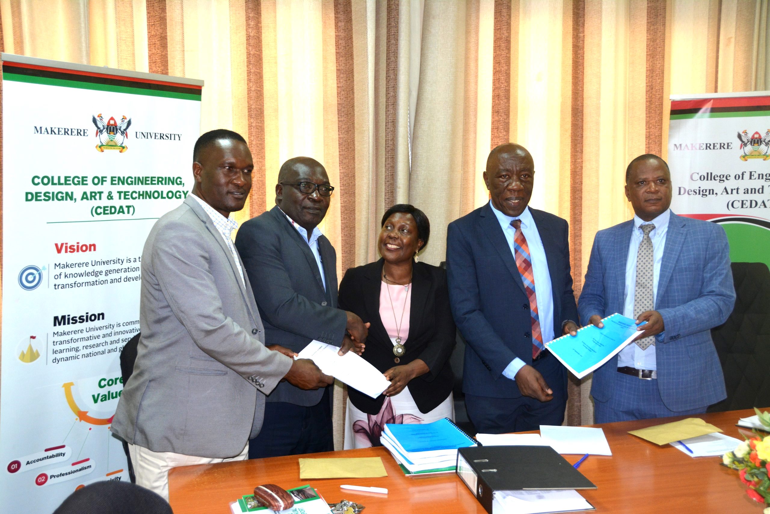 Prof. Henry Alinaitwe (2nd Right) hands over to incoming Principal, Assoc. Prof. Moses Musinguzi (Right) while Assoc. Prof. Venny Nakazibwe (Centre) hands over to incoming Deputy Principal, Assoc. Prof. Kizito Maria Kasule (2nd Left) as the Directorate of Internal Audit's Mr. Aggrey Luwuliza (Left) witnesses on 29th September 2023. The Boardroom, College of Engineering, Design, Art and Technology (CEDAT), Makerere University, Kampala Uganda. East Africa.