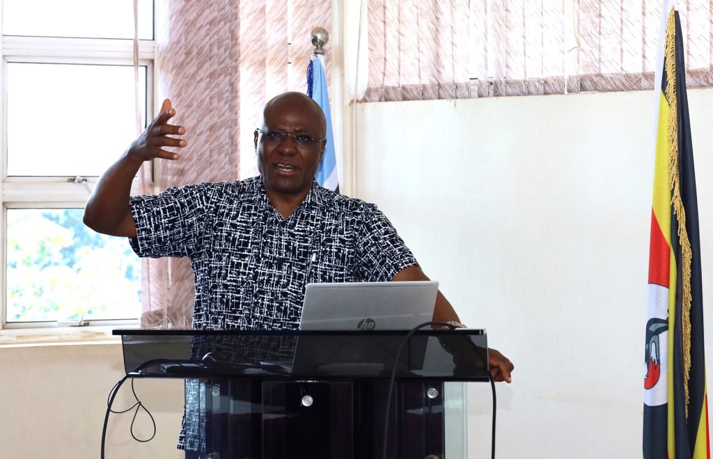 Canon Goddy Muhumuza presenting to CoCIS staff in the Conference Room Block A. College of Computing and Information Sciences (CoCIS), Makerere University, Kampala Uganda, East Africa.