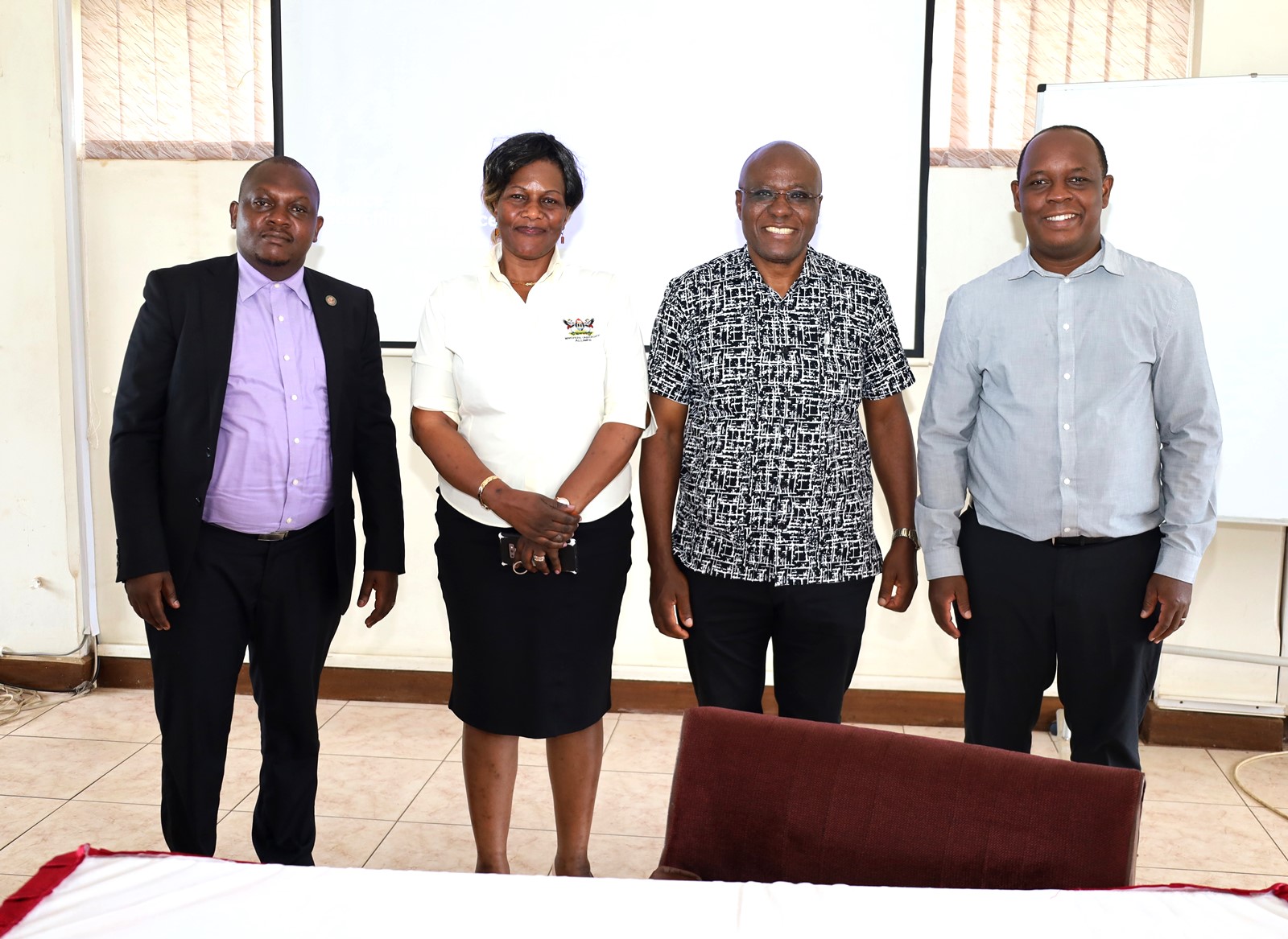 Left to Right Mr. Peter Eneru, Dr. Joyce Bukirwa Muwanguzi, Canon Goddy Muhumuza and Dr. Peter Nabende in group photo after the meeting on 20th October 2023. Conference Hall, Level 4, Block A, College of Computing and Information Sciences (CoCIS), Makerere University, Kampala Uganda, East Africa.
