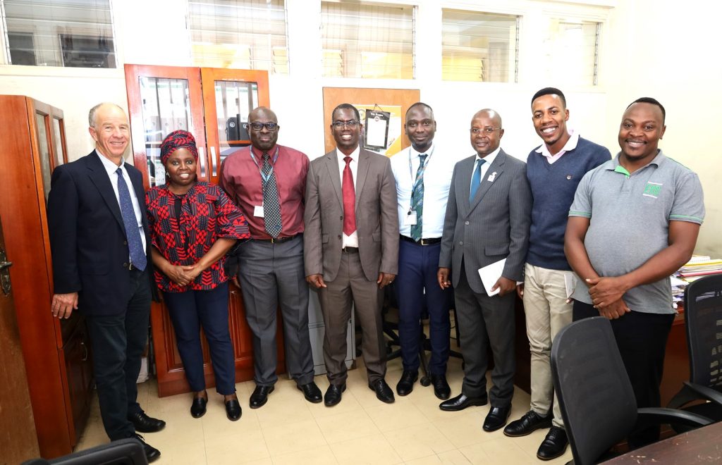 The Panel in a group photo after meeting Commissioner Sam Mugume (3rd Left) at the Ministry of Finance, Planning and Economic Development. Kampala Uganda, East Africa.