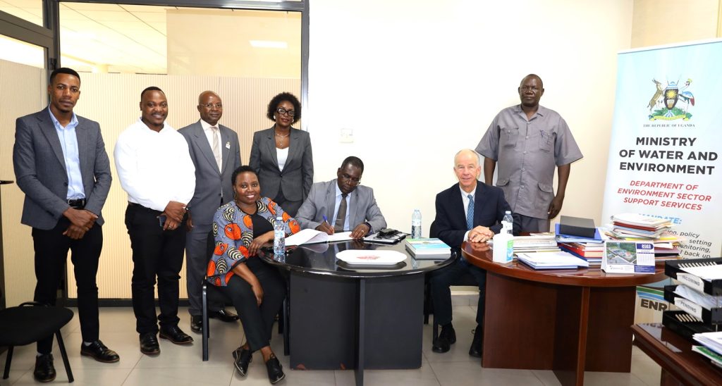 Evaluators (seated) in a group photo at the Ministry of Water and Environment after meeting the Commissioner Mr. Steven Mugabi (Right) and IGE fellow Moreen Aneno (4th Left). Kampala Uganda, East Africa.