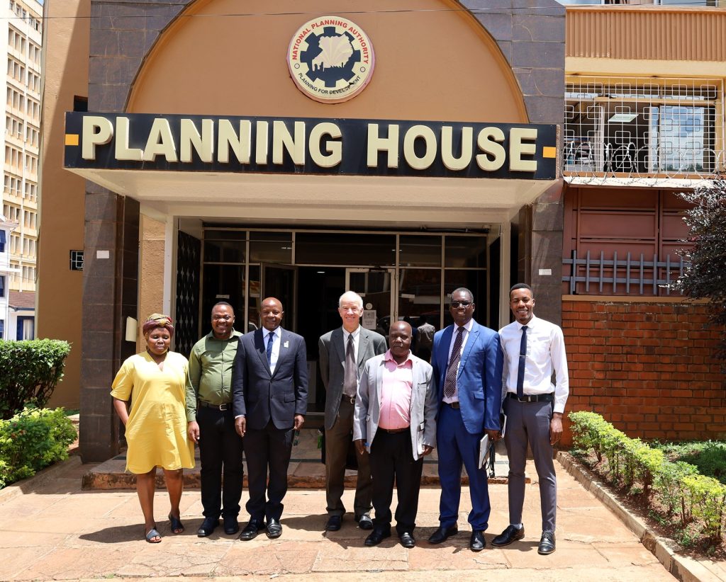 Evaluators posing for agroup photo at the National Planning Authority after engaging with Ronald Kaggwa (3rd Right) one of the pioneer IGE fellows. Kampala Uganda, East Africa.