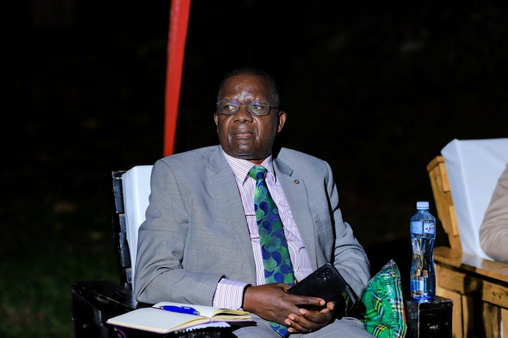 Dr. Saturninus Mulindwa Kasozi follows proceedings at the Ekyooto. Julius Nyerere Leadership Centre (JNLC), Plot 111, Pool Road, Makerere University. Kampala Uganda, East Africa.