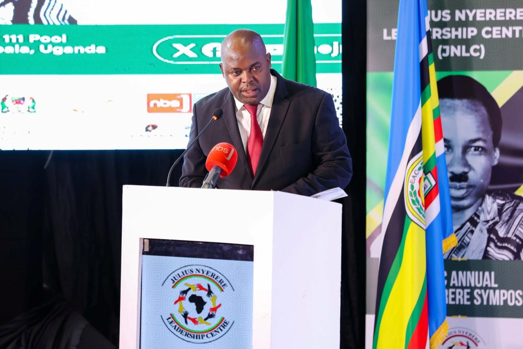 The Charge d’Affaires and Acting High Commissioner of the United Republic of Tanzania to Uganda, H.E. Mr. Lucas Mayanga delivers his speech. Yusuf Lule Central Teaching Facility Auditorium, Makerere University, Kampala Uganda.