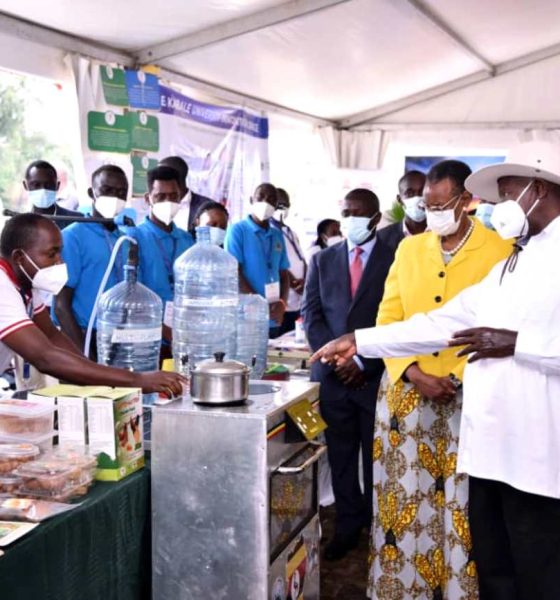 President Yoweri Museveni and First Lady Hon. Janet Museveni listen to Dr. Peter Tumutegyereize (Left) explain how the Mak Solar Cooker works. Photo: Courtesy/NCHE@20, Kololo Ceremonial Grounds. Kampala, Uganda, East Africa.