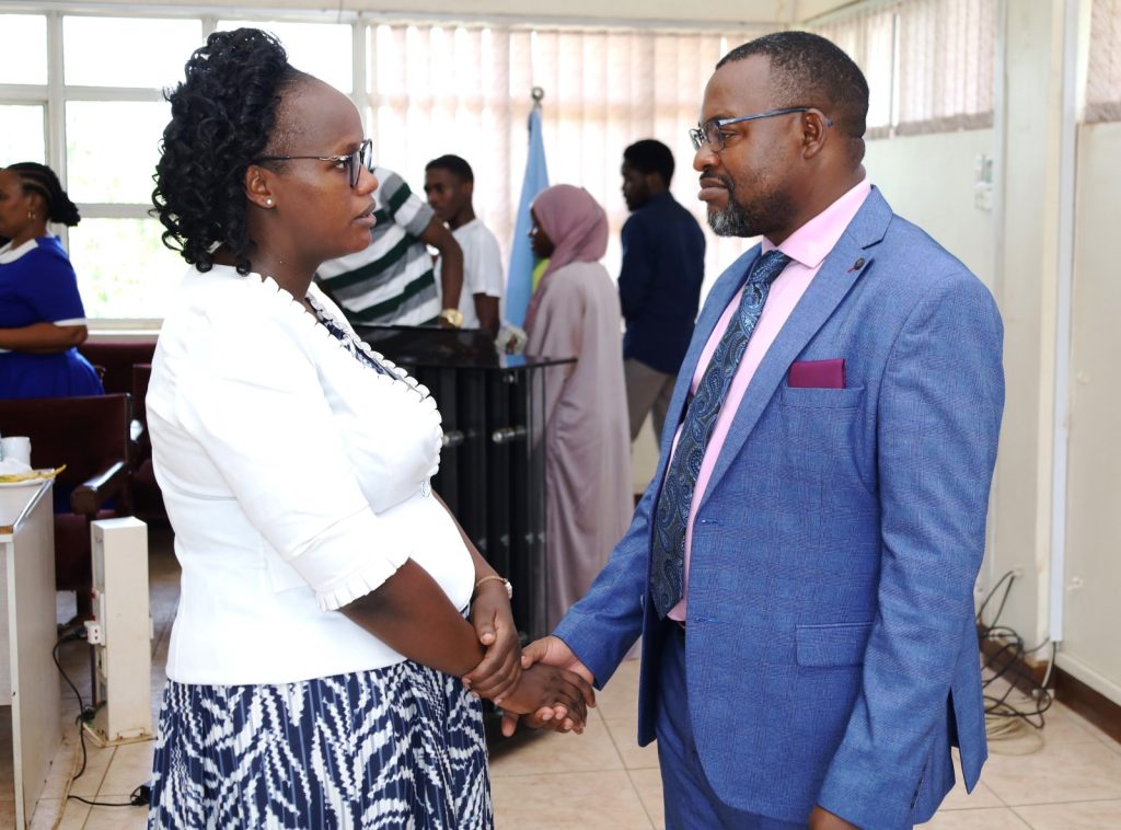 Mak-RIF representative Grace Ruto-Cherotich (Left) interacts with the PI, Paddy Junior Asiimwe (Right). College of Computing and Information Sciences (CoCIS), Makerere University. Kampala Uganda, East Africa. 