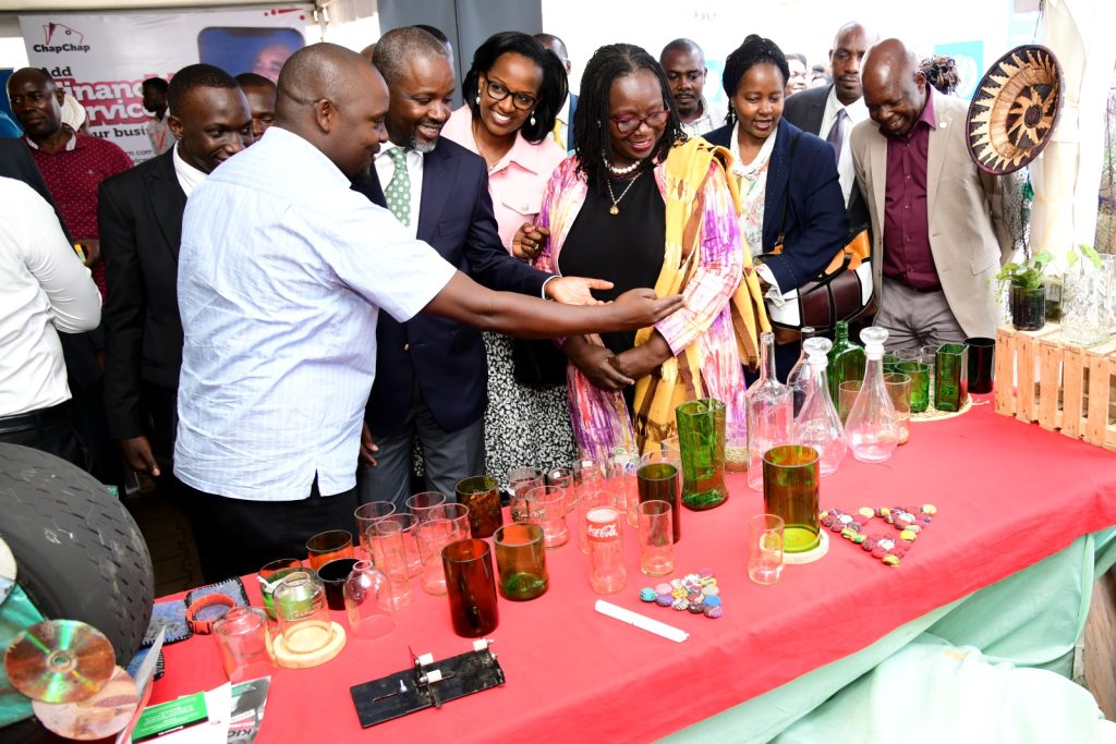 Rt. Hon. Thomas Tayebwa, H.E. Elsie Attafuah, Mrs. Lorna Magara and other officials interact with one of the exhibitors in the UNDP Tent. Youth and Innovation Expo 2023, Yusuf Lule Central Teaching Facility, Makerere University, Kampala Uganda, East Africa.