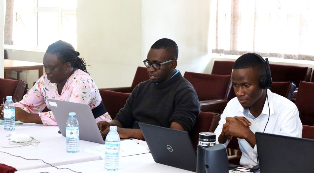 AirQo PI Assoc. Prof. Engineer Bainomugisha (Centre) attending the training with other staff. Accountability Protocols Training, 23rd November 2023, Conference Room, Level 4, Block A, CoCIS, Makerere University, Kampala Uganda, East Africa.