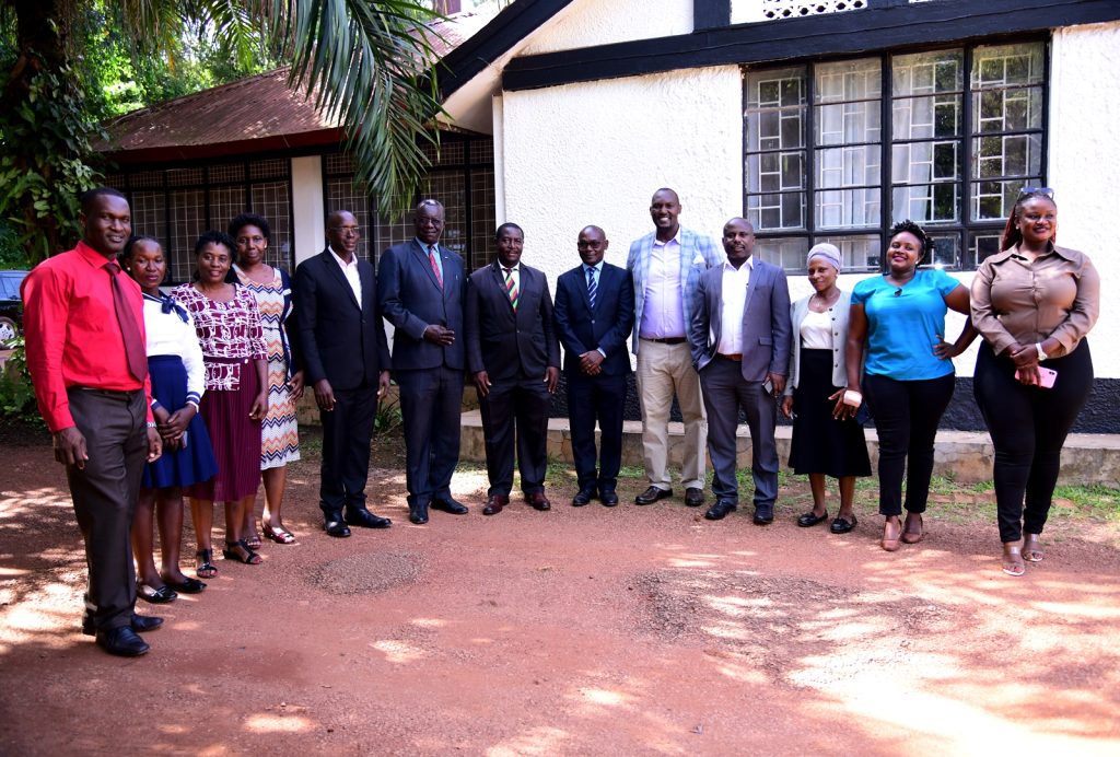Staff from the Directorate of Internal Audit pose for a group photo with Mr. Walter Yorac Nono (8th R) at the luncheon. Makerere University Guest House, Kampala, Uganda, East Africa.