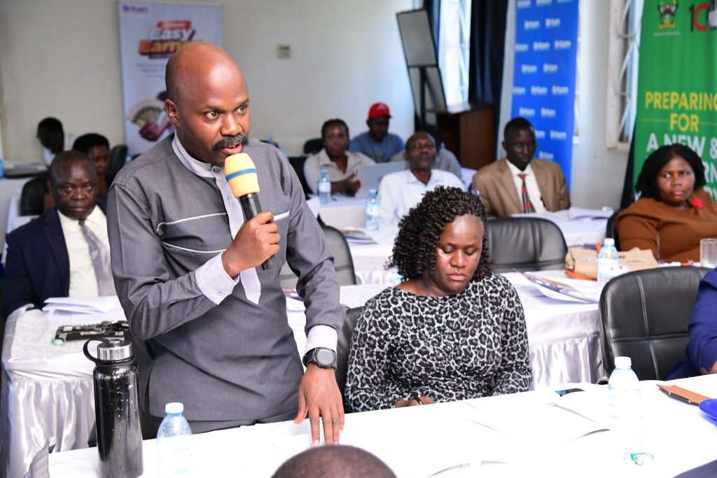 The Chairman MUASA, Dr. Robert Kakuru (Standing) contributes to the discussion following the presentation. In the background are Leaders and Members of Staff Associations. MURBS Presentation of Performance FY 2022/2023, 24th October 2023, Telepresence Centre, Level 2, Senate Building, Makerere University, Kampala Uganda. East Africa.